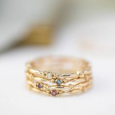 This dainty birthstone stackable ring is unlike any other, the band has a unique design all around which gives a bit of antique feel. Perfect gift for July birthdays! * Stock size: US 7 * Genuine 1.5mm garnet * Band width: ≈1.75mm * Setting size: ≈2mm * Material: 14k solid yellow gold (rose gold or white gold option available) * Made of 100% recycled precious metal and ethically sourced gemstone * Comes in a gift box with a bow ready for gifting * Handmade with love and great care in New York &l Aquamarine Stacking Ring, Aquamarine Solitaire Ring, Citrine Birthstone, Stackable Birthstone Rings, Aquamarine Birthstone, Garnet Birthstone, Topaz Birthstone, Amethyst Birthstone, Diamond Stacks