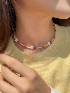 Rainbow flowers beaded chocker necklace for women. Wether it is a summer beach party, birthday, evening date, it will complete your total look beautifully. If you want to make happy your loved one or yourself, then you found a perfect gift. Length: 38+5cm Material: High quality zinc alloy.  ✦ SHIPPING & PACKAGING ✦ Each product packed in a very cute packaging 🎁 The items will be send 1-2 working days after payment. The package will be send from the Germany 🇩🇪 . It depends on where you live ho