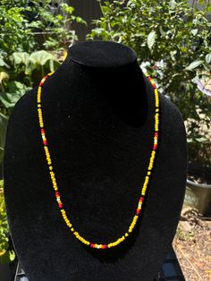 Yellow themed beaded necklace with accents from the Medicine Wheel Yellow Necklaces With Letter And Round Beads, Yellow Necklaces With Round Letter Beads, Yellow Necklace With Letter Beads, Bohemian Yellow Necklace With Letter Beads, Bohemian Yellow Letter Beads, Yellow Bohemian Letter Beads, Yellow Round Beaded Spiritual Necklace, Festival Necklace With Round Letter Beads, Yellow Spiritual Beaded Necklace For Gifts