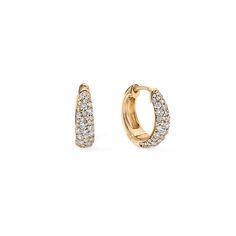 A classic twist on the pave huggie earring for a timeless accessory that embodies understated refinement. Crafted from gleaming gold and sparkling diamonds, these earrings feature a snug, hoop-like design that "hugs" the earlobe closely. Their simplicity and versatility make them an essential addition to any jewelry collection, effortlessly complementing both casual and formal looks. Available in 14K White, Yellow, and Rose Gold Diamond weight = 0.53 carats Diamond quality = GH-Color, SI-Clarity Luxury Cubic Zirconia Halo Huggie Earrings, Luxury Huggie Earrings With Shiny Finish, Luxury Round Huggie Earrings With Halo, Luxury Round Huggie Earrings, Luxury Metal Round Huggie Earrings, Luxury Modern Round Huggie Earrings, Luxury Round Channel Set Huggie Earrings, Luxury Diamond Huggie Earrings As Gift, Luxury Oval Huggie Earrings