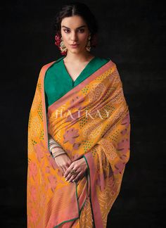 Yellow And Green Embroidered Festive Saree has classic and stylish appeal with all the hues of indian traditional touch. This saree is embedded perfectly with bandhani motifs all over pallu on pure organza silk saree with tassel detail paired with resham thread and sequence embroidered vibrant silk blouse. Drape this saree on parties and events with heels and handcrafted jewellery to look like a diva. Shop Latest Indian Saree In USA, UK, Canada, Germany, Mauritius, Singapore With Free Shipping W Saree Patola, Sabyasachi Designer, Saree Paithani, Festive Saree, Saree Organza, Saree Kanchipuram, Saree Cotton, Saree Georgette, Cotton Saree Blouse