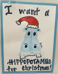 i want a hippopotamus for christmas sign hanging on the wall in front of a door