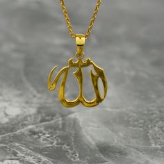 Crafted with exquisite detail and elegance, the Tiny Allah Necklace is a true masterpiece of Islamic jewelry. Made from premium sterling silver and delicately gold plated, this pendant showcases the word "Allah" in beautifully intricate Arabic script. Perfect for Muslim women, this necklace is a meaningful and thoughtful gift that symbolizes faith and devotion. Its tiny size adds a subtle touch of sophistication, making it suitable for everyday wear or special occasions. Whether worn alone or la Classic Gold Charm Necklaces With Polished Finish, Traditional Yellow Gold Personalized Jewelry, Traditional Personalized Yellow Gold Jewelry, Traditional Gold Personalized Necklaces, Gold Pendant Charm Necklace For Formal Occasions, Personalized Gold Spiritual Jewelry And Charms, Gold Round Pendant Name Necklace For Wedding, Gold Name Necklace With Round Pendant For Wedding, Gold Polished Nameplate Jewelry