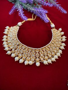 High gold plated designer Tyaani Kundan set with matching Chandbali. Next to real anti tarnish platting, hypoallergenic. Suitable for anything . Can be worn as a necklace or choker. About 1.5 inch wide on the neck. Earring is 2 inch long , push back and very very light weight . Bridal Choker Necklace With Intricate Design For Celebration, Ceremonial Tilla Choker Jewelry, Bridal Choker Necklace With Intricate Design For Festive Occasions, Intricate Design Bridal Choker For Festivals, Ceremonial Hand-set Bridal Choker Necklace, Festival Bridal Necklace With Intricate Design Choker, Festive Bridal Choker Necklace With Intricate Design, Festive Bridal Choker With Intricate Design, Chandbali Hand Set Choker For Festivals