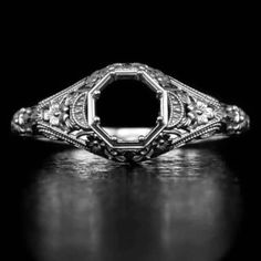 Featured here is a beautiful filigree semi-mount that is a memento of the Art Deco period! This ring is made from a mold of an original vintage piece that we have. It was one of the few rare pieces we have found with very intricate filigree and great detail. The design is timeless and as soon as we saw the original, we fell in love with the ring. The original piece was made in the 1920's and has all of the classic vintage details. The intricate filigree and engraving detail is beautiful! This looks truly like the original vintage piece as the mold was made from the old model. The pictures do not do justice to this piece because in real life you can see all of the small details together and really appreciate the rare early 1900's character of it. We certainly recommend a first hand look. Th Diamond Intaglio Jewelry, Round Diamond Intaglio Jewelry, Luxury Engraved Ring With Intricate Design, Luxury Oval Filigree Ring With Intricate Design, Elegant Ceremonial Engraved Ring With Filigree, Heirloom Diamond Jewelry With Intaglio, Classic Oval Engraved Ring With Filigree, Antique Engraved White Gold Ring With Intricate Design, Antique White Gold Engraved Ring With Intricate Design