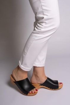 Beach Clogs With Cork-bed Midsoles And Round Toe, Casual Black Mules With Cork-bed Midsoles, Black Platform Clogs With Wedge Heel, Beach Clogs With Rubber Sole And Round Toe, Beach Clogs With Round Toe And Rubber Sole, Casual Black Open Heel Platform Slippers, Black Clogs With Cork-bed Midsoles And Round Toe, Casual Summer Clogs With Leather Sole, Leather Slide Clogs For Summer