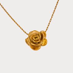 Add a touch of romance with our Gold Rose Pendant Necklace. This delicate floral charm necklace is perfect for elegant and everyday wear. Shop now at Tomoko Store for timeless beauty Finish: 18K Gold plated Waterproof: does not change color from water exposure Lead and nickel free Material: Stainless steel(waterproof!) Size: 42x5cm Weight: 5g All our jewelry are made of stainless steel material. For the gold pieces, we added an 18K PVD gold plating. This means the colour will last for a really l Rose Pendant Necklace, Stackable Jewelry, Cubic Zirconia Necklace, Rose Pendant, Heart Chain, Trendy Earrings, Statement Bracelet, Fine Earrings, Steel Material