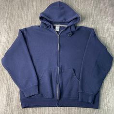 Vintage 2000s Russell Athletic Basic Blank Sportswear Streetwear Y2K Aesthetic Navy Zip Up Hoodie Large Mens Condition: Fair Used Condition = Missing pull tab plus flaws on the cuffs due to wear and age. Measurements: Please see photos above for all measurements IF YOU BUY TWO OR MORE ITEMS USE THE CODE BUNDLE @ CHECK TO SAVE 20% WE SHIP WITHIN 24 HOURS AFTER PURCHASE! Please be aware that we do not offer free returns!! The Buyer is responsible for the cost of the return label.  Follow us on TikTok & Instagram @findsnostalgic and tag us in your finds Dark Blue Zip Up, 90s Style Sports Hoodie With Drawstring Hood, 90s Hooded Sweatshirt For Sports, 90s Style Hooded Sweatshirt For Sports, Cotton Hooded Activewear For Sports Events, 90s Style Sports Hoodie In Blue, 90s Cotton Sports Hoodie, 90s Style Cotton Sports Hoodie, 90s Cotton Hoodie For Sports