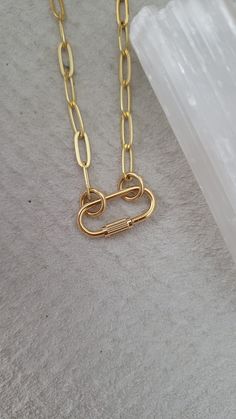 "Mini lock necklace - heavy 16k gold plated over brass - 16\" + 2\" extension - screw charm about 3/4\" long and 1/2\" wide (please see photo for exact mm) - ☆ the inner diameter of the rings/circle that slide into the Carabiner are 5mm, if you would like a larger size ring or specific mm message me your request ☆ Style option to purchase the necklace as pictured or the Carabiner only ♡ for the minimalist style person or everyday layer gal ◇ Another mini Carabiner option here https://www.etsy.com/listing/795710907/mini-carabiner-necklace-screw-necklace?ref=shop_home_active_1 * If you would like a different length of chain can select \"carabiner only\" and purchase your desired chain length seperate here ⬇️ https://www.etsy.com/listing/773867462/carabiner-chain-paperclip-chain?ref=shop_home Minimalist Gold Necklace With Hooks And Links, Gold Paperclip Necklace With Hooks And Links, Gold Chain Link Necklace With Carabiner Clasp, Carabiner Necklace, Necklace Lock, Lock Necklace, Unusual Jewelry, Circle Ring, The Rings