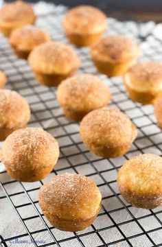 some sugared muffins are on a cooling rack