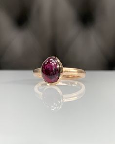 Natural Rhodolite Garnet Ring * Dainty Cabachon Ring * Genuine Garnet & 14K Solid Gold * Best Gift for Her/Him * Handmade Ring ◎ Details ◎ ○ Gemstone Details .Natural RHODOLITE GARNET Oval Cut 9X7 mm approx. 2.11 ct ○ Gold Details 14K Solid Gold Width of Band : 2.50 mm Weight of Ring : approx 3.80 gr Made to Order HANDMADE ITEM ○ Upgrade to Solid 18K Gold, please click the link below: https://www.etsy.com/listing/962826004 For more CABACHON BEZEL rings : http://etsy.me/37fvI60 All of our jew Classic Oval Cabochon Sapphire Ring With Bezel Setting, Timeless Cabochon Sapphire Ring, Classic Domed Yellow Gold Sapphire Ring, Classic Sapphire Ring With Oval Cabochon Bezel Setting, Classic Yellow Gold Domed Sapphire Ring, Classic 14k Gold Sapphire Oval Cabochon Ring, Formal Yellow Gold Domed Sapphire Ring, 14k Yellow Gold Dome Ring With Oval Cabochon, Timeless Cabochon Rings For Formal Occasions