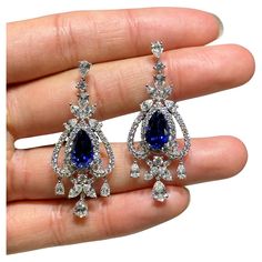 The Following Item we are offering is a Rare Important Radiant 18KT Gold Large Rare Fancy Blue Ceylon Sapphire and Diamond Earrings. Earrings are comprised of Gorgeous Ceylon Blue Sapphires Spectacularly Set in and surrounded by Magnificent Glittering Fancy Cut Diamonds!!! T.C.W. approx 15CTS!!! These Gorgeous Earrings are a Rare Sample Pair from a Private Manufacturer that sold to Important 5 Star Hotel and Fine Jewelry Stores and comes Brand New With Tags $170,000. Elegant Luxury Jewelry With Lab-created Sapphire, Luxury Sapphire Fine Jewelry, Luxury Exquisite Gemstone Earrings, Blue Jewel Earrings, Sapphire Aesthetic, Expensive Earrings, Dark Blue Earrings, Navy Blue Earrings, Rare Jewelry