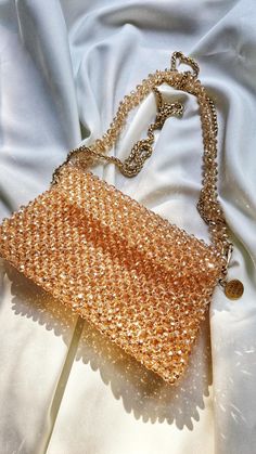 Luxury Beaded Top Handle Evening Bag, Luxury Beige Bags For Gifts, Luxury Beige Bags For Gift, Luxury Handheld Beaded Shoulder Bag, Luxury Tote Evening Bag For Gift, Luxury Tote Evening Bag As Gift, Elegant Handmade Rectangular Shoulder Bag, Beaded Beige Bags For Party, Beige Beaded Bags For Party