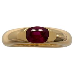 Vintage Cartier Vivid Red Ruby 18k Yellow Gold Solitaire Band Ring. Stunning yellow gold ring set with a vivid red ruby. Fine jewellery houses like Cartier only use the finest of gemstones and this ruby is no exception. An excellent quality ruby with fine colour and an excellent oval cut. Measures 6x4mm approx. 0.60 carat. The ruby has some small natural inclusions but still a clean stone. The ring is signed Cartier 750 with serial numbers and a French eagle hallmark. Ring size UK M - US 6 - EU 52 - Some resizing is possible. Please message us with any sizing requirements before purchasing. This has been professionally polished and cleaned to excellent condition. Very bright and shiny. Ring weighs 9.6g. A heavy and well made piece. Comes with original Cartier ring box. All our photos are t Yellow Gold Solitaire Ring, Solitaire Bands, Yellow Gold Solitaire, Gold Solitaire Ring, Gold Ring Sets, Red Ruby, Cartier Ring, Yellow Gold Ring, Ruby Ring