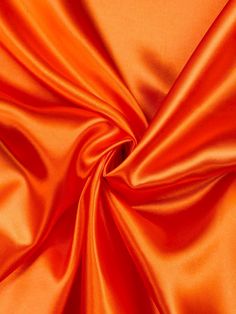 This luxurious satin fabric is perfect for your special occasion designs. Available by the yard, this 58/60 inch wide satin comes in an array of vibrant colors sure to dazzle. The heavy weight brings an elegant drape and flow to any garment while maintaining a smooth, lustrous finish. Ideal for wedding and formal gowns, this satin is also suitable for accessories like sashes, headpieces and more. Sew with care as the shiny satin surface can show flaws. Pre-washing is not recommended as it may damage the silky texture. Allow extra fabric for hemming and seam allowances. Enjoy crafting stunning looks with this high quality satin fabric. GORGEOUS SATIN: This shiny satin fabric features a beautiful color palette and luxe feel with a heavy weight for draping nicely. VERSATILE FABRIC: The satin Festival Skirts, Silk Satin Fabric, Elegant Drapes, Rainbow Color, Polyester Satin, Formal Gowns, Luxury Fabrics, Fabric By The Yard, Dressmaking