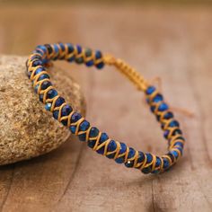 Indulge in the timeless beauty of the Blue Tiger Eye Boho Faceted Crystal Bead Woven Bracelet. Made with expert craftsmanship and high-quality natural stones, this stunning bracelet effortlessly exudes style and sophistication. The intricate weaving of the blue tiger eye beads create a unique and eye-catching texture. The natural stone of the tiger eye exudes an elegant sheen that perfectly contrasts the subtle sparkle of the crystal beads. This exquisite piece of jewelry is not just stylish, bu Bead Woven Bracelet, Blue Tiger Eye, Blue Tiger, Woven Bracelet, Blue Tigers, Blue Tigers Eye, Tiger Eye Beads, Eye Beads, Woven Bracelets