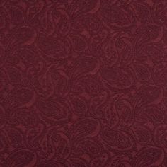 a red background with an intricate pattern on the fabric, it is very soft and warm