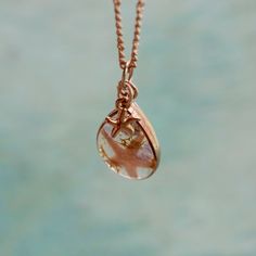 "̩̩͙✩ Handmade rose gold colored necklace with a starfish/amethyst crystal pendant ✩*̩̩͙*˚ Overview: ⋆ 1 x 0.75 inch rose gold colored pendant with amethyst crystals, reindeer moss & genuine starfish in resin-cast teardrop shaped frame ⋆ 18 inch rose gold colored chain with lobster clasp closure ⋆ Real amethyst crystals sourced from Brazil ⋆ February birthstone ⋆ Real starfish sourced from Florida, USA This pendant is made of tiny tumbled purple amethyst stones, a small sea star, and wisps of green moss sealed in a durable, clear resin window. The crystals partially extend beyond the resin on the front side and the back surface of the pendant is flat for ease of wear. The small star charm is about 0.25 inch long and can rest on either the front or back of the crystal pendant. The 18 inch/4 Dainty Rose Gold Pendant Crystal Necklaces, Rose Gold Crystal Pendant Necklace For Jewelry Making, Dainty Rose Gold Teardrop Pendant Drop Necklace, Copper Teardrop Necklace For Gifts, Rose Gold Teardrop Charm Necklaces As Gift, Rose Gold Teardrop Charm Necklace For Gift, Handmade Rose Gold Pendant Charm Necklace, Rose Gold Teardrop Necklace For Gifting, Rose Gold Teardrop Necklace Gift