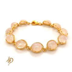 Effective Bracelet with Genuine Moonstone It is made of gold-plated 925 silver (Ag 925) We are plating our Goods with a thick layer of gold, therefore You can be satisfied with quality for ages. Standard length of this bracelet is around 18,5 cm, but there is a possibility to make it a little bit longer (up to 21 cm) because of the chain we put in the end. Bracelet is made of individual elements made of silver gold-plated and Moonstone. Cabochons measurements are 8x10 mm. Each of them may appear Gold Faceted Crystal Bracelet, Adjustable Gold Rose Quartz Jewelry, Gold Dainty Crystal Bracelet With Natural Stones, Elegant Gold Bracelets With Rose Quartz, Dainty Gold Crystal Bracelet With Natural Stones, Gold Moonstone Round Bracelets, Gold Bracelets With Rose Quartz And Natural Stones, Spiritual Gold Bracelets With Moonstone, Elegant Gold Crystal Bracelet With Natural Stones