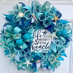 a life is better at the beach wreath with starfishs and seashells