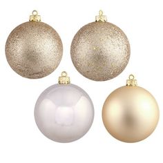 three white and one gold christmas ornaments on a white background with clipping for text