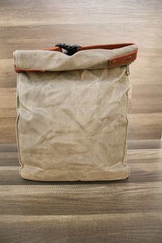 Our kibble bag was designed to last! They are made with 16oz waxed canvas and lined with a BPA free waterproof lining. Extra strong stitching, a smooth antique brass YKK zipper, a YKK buckle, and faux leather strapping that is so soft, yet durable! Each kibble bags holds approx. 40 cups of dry food. It can also be used for dehydrated or jerky style dog food, a treat bag for on the road (think a bunch of smaller treat bags), and more! Every kibble carrier comes with a 1 cup stainless steel measur Practical Lunch Bag With Zipper, Practical Lunch Bag With Zipper For Everyday, Khaki Backpack With Waxed Finish, Khaki Waxed Finish Backpack, Khaki Waxed Finish Standard Backpack, Waxed Canvas Shoulder Bag With Canvas Lining Backpack Style, Rectangular Waxed Canvas Bag With Zipper, Khaki Waxed Canvas Bag With Waxed Finish, Khaki Waxed Canvas Bag With Canvas Lining