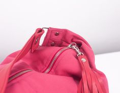 "This is the mini version of the Kallia bag.For those who aren't used in carrying large purses,this is the ideal size.Still roomy enough to carry your daily essentials inside but in a smaller size. This slouch bag was made using a pink cotton canvas and genuine leather for the handle and zipper pulls. All the leather parts can be removed from the bag so it is easier to clean it ,in case it gets dirty.Not to mention that you can order extra handles and zipper pulls and interchange the colors depe Pink Weekender Bag With Removable Pouch, Canvas Hobo Bag With Removable Pouch For Errands, Pink Duffle Bag With Removable Pouch For Everyday Use, Versatile Canvas Hobo Bag For Errands, Trendy Pink Weekender Bag For Everyday Use, Pink Shoulder Weekender Bag For Everyday Use, Pink Weekender Bag With Double Handle, Pink Double Handle Weekender Bag For Everyday Use, Pink Shoulder Weekender Bag With Adjustable Strap