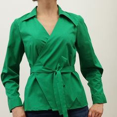 wrap shirts for  women  rich green colour  shirts with belts, long sleeves with small pleats  green blouse  with asymmetrical collar Perfect fits for autumn season. Trendy Office Tops With Lapel Collar, Elegant Green Shirt For Spring, Elegant Green Spring Shirt, Fall Collared Slim Fit Tops, Chic Asymmetrical Fall Shirt, Elegant Belted Blouse For Work, Versatile Formal Spring Tops, Slim Fit Collared Tops For Fall, Versatile Formal Tops For Spring