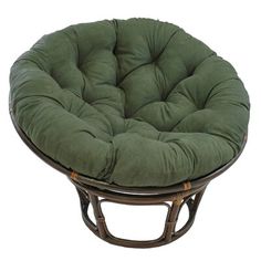 a round chair cushion sitting on top of a wicker stool with bamboo frame and legs