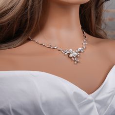 "Crystal with pearl bridal jewelry set: necklace, bracelet and earrings.  Gorgeous bridal or MOB jewelry set for your wedding day. Necklace measures about 17\" long.  Earrings are about 1\" long and 1/2\" wide. Matching regular bracelet is measuring: 7\" long and 1/4\" wide or an adjustable bolo matching bracelet is available as well. High quality guaranteed by GlamourBrideUSA! SHIPPING: Standard Shipping: 4-6 business days Priority mail Shipping: 2-3 business days *INTERNATIONAL ORDERS: PLEASE Silver Pearl Bridal Accessories For Bride, Wedding Crystal Jewelry Sets With Pearl Drop, Wedding Crystal Pearl Drop Jewelry Sets, Silver Pearl Bridal Accessories, Silver Pearl Wedding Jewelry Sets, Crystal Pearl Drop Jewelry Sets For Wedding, Delicate Silver Jewelry Sets For Wedding, Silver Bridal Accessories With Pearl Drop, Silver Pearl Drop Bridal Accessories