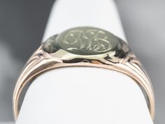 "Featuring components from different eras, this one-of-a-kind signet ring is a delightful combination of green and rose gold! The monogram at the center is beautifully engraved in ornate French script, while the ring's shoulders have subtle motifs that catch the light and shine. Please note that this signet ring has an original monogram, and unfortunately, this piece cannot be altered without affecting the quality of the piece. Please feel free to contact us to help you find your perfect signet Victorian Oval Signet Ring With Maker's Mark, Classic Collectible Signet Ring With Engraving, Heirloom Rose Gold Rings With Hallmarks, Luxury Round Signet Ring With Hallmarks, Classic Round Signet Ring For Collectors, Victorian Round Signet Ring With Engraving Option, Classic Round Signet Ring Collectible, Oval Ring With Maker's Mark For Gift, Victorian Hallmarked Round Signet Ring