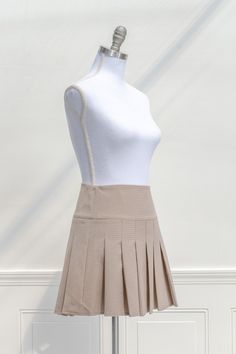 Inspired by vintage academia, the Tabitha mini skirt features a pleated hem, taupe plaid print, and a short length. Perfect with tights, a cardigan, and beret for a French-inspired collegiate look! . Details: XS: Waist 25", Length 15.5 S: Waist 27", Length 16" M: Waist 29", Length 16.5" L: Waist 31", Length 17" Unlined Material: 80% Polyester, 20% Rayon Hand Wash Cold / Hang Dry Imported Ships in 1 to 2 Business Days Free US Shipping on Orders over $100 Vintage Academia, French Girl Style, Plaid Mini Skirt, French Inspired, 5 S, French Girl, Plaid Print, Types Of Skirts, Skirt Top