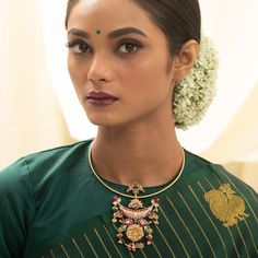 Description Redefine traditionalism in this eclectic Kempu silver neckpiece, crafted by skilled artisans in Hasli style. Cascading demurely down the feminine cleft, this masterpiece combines contemporary interpretations of flora and fauna with a handcrafted nakshi coin depicting goddess Lakshmi at the apex. Ruby, emerald pumpkin beads and pearls join the arrangement to create a symphony of vivid colours in this avant-garde piece. Product Information Materials used : 925 Silver with 1.0-microns G Ceremonial Temple Jewelry Long Necklace, Temple Jewelry Choker For Festivals, Elegant Temple Necklace With Meenakari, Peacock Design Pendant Necklace, Ceremonial Fusion Style Kundan Necklace, Elegant Necklace For Diwali Rituals, Elegant Necklaces For Diwali Rituals, Gift Kundan Necklace With Oxidized Finish, Traditional Wedding Necklace With Detachable Pendant