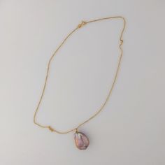 This premium-quality Chinese Freshwater pearl pendant features a bead-nucleated pearl affixed to an 18K yellow gold bail. The pearl has an organically smooth baroque shape, measuring 17-18 by 23mm and weighing 5.2g. If paired with an optional chain, the total weight comes to 6.7g. Displaying a naturally metallic blend of purple, pink, and peach hues, accented by green and pink overtones, the pearl has a luminous glow. The pearl's surface is clear, which allows its stunning beauty to be fully app Briolette High Luster Pearl Necklace Gift, High Luster Briolette Pearl Necklace As Gift, High Luster Briolette Pearl Necklace For Gift, Luxury Drop Pearl Necklace For Gift, Handmade Gold Pearl Necklace With Briolette, Gold Tahitian Pearl Pendant Necklace, Yellow Gold Pearl Necklace With High Luster Baroque Pearls, Yellow Gold High Luster Baroque Pearl Necklace, Baroque Pearl Necklace With Teardrop Pendant