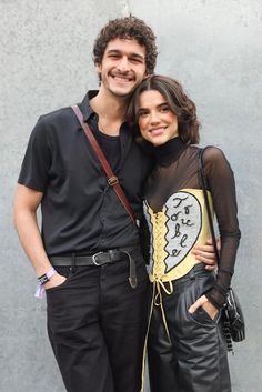 a man and woman standing next to each other