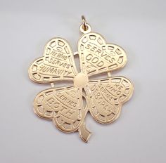 Vintage 14K Yellow Gold Four Leaf Clover Shamrock Charm Pendant. This pendant is 14KT Yellow Gold, measures 34 X 33 mm and weighs 11.0 grams.  There is writing on each of the clover leaves ( Serves God, We Who Serves Deborah, Serves Both, He Who Serves Humanity). I will ship this pendant promptly in a gift pouch.  ADDITIONAL REQUESTS If you would like to see more pictures of this item, please let us know and we would be happy to provide them for you. Please contact us with all questions, we are Clover Leaves, Clover Pendant, Four Leaves, Gift Pouch, Four Leaf, Leaf Clover, Four Leaf Clover, Clover Leaf, Charm Pendant