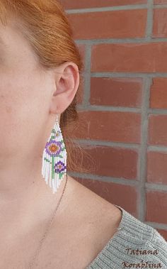 These handmade unique earrings with abstract floral print are made of high-quality Czech beads and strong synthetic thread. I use my author's scheme . They are elegant, fashionable, and highly versatile, suitable for everyday wear. Color: white,pink,purple,red,orange, green . 100% hand made with love! I beg you not to copy my authoring Copy without my permission is prohibited For those who want to buy my copyright scheme for these earrings: https://www.etsy.com/uk/listing/974991392/brick-stitch- White Dangle Flower Earrings With Colorful Beads, White Flower Dangle Earrings With Colorful Beads, Colorful Beaded White Chandelier Earrings, White Dangle Flower Earrings With Beads, White Flower Drop Earrings For Summer, White Beaded Earrings For Summer Gift, White Flower Shaped Beaded Earrings With Colorful Beads, Handmade White Dangle Flower Earrings, White Handmade Drop Flower Earrings