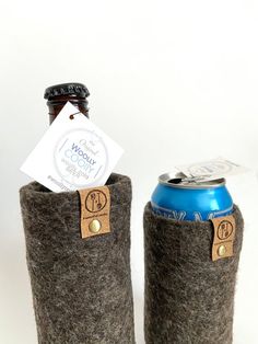 two beer can holders made out of felt and leather, one with a label on it