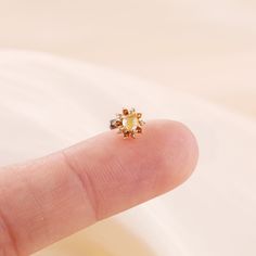 Metal: 14K solid gold, Not Plated or Gold Filled Available Gold color: Yellow gold  Stone: Citrine, Yellow Hair Quartz  Thickness: 0.82mm (20G) , 1.0mm (18G), 1.2mm (16G) Stamp: 14K on top or 14K gold back, no stamp on titanium back, ★Sold as single piece ★Threadless Push Pin (Flat Back) ★ We have two different materials of Push back for you choose: ● One is 14K solid gold with length : 6mm(standard), 8mm, 10mm (long)  ● Another is implanted grade titanium push back in size 5mm(short) 6mm 8mm an Dainty Gold Piercings With Birthstone, Tiny Rose Gold Flower Shaped Jewelry, Single Gold Flower Earring, Delicate Yellow Gold Piercings For Gift, Gold Flower Single Earring Jewelry, Gold Flower-shaped Single Earring, Tiny Gold Cartilage Earrings Fine Jewelry, Dainty Gold Cartilage Earrings With Birthstone, Tiny Gold Flower-shaped Jewelry