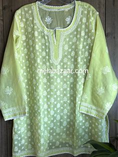 "Soft cotton Chikankari hand embroidered blouse. Matching liner Included. Length: 30 inches \"Embroidery designs vary \"" Luxury Cotton Chikankari Embroidered Top, Embroidered Straight Kurta Top In Chanderi, Embroidered Chanderi Straight Kurta Top, Eid Green Top With Floral Embroidery, Semi-stitched Blouse With Chikankari Embroidery For Eid, Green Floral Embroidered Straight Kurta, Festive Chikankari Embroidered Top, Pista Green Long Sleeve Traditional Wear With Chikankari Embroidery, Pista Green Chikankari Embroidery Straight Kurta