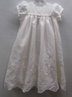 Savannah is an heirloom baptism, blessing, christening gown. This baby girl gown is precious beyond description! Savannah is made of Italian embroidered milk white cotton lace. She drapes beautifully for any baby girl. This gown is a high yoke design. The full skirt of this infant gown is fully lined. Savannah has short puffed sleeves. She buttons in the back with two buttons for easy dressing. A favorite handmade heirloom gown for any little baby girl. Limited quantities. NOTE: My sizes run lar White Lace Dress For First Communion, Elegant Lace Dress For Baptism, Elegant White Lace Dress For First Communion, Fitted Ruffled Dress For First Communion And Baptism, Elegant Lace Work Dress For Confirmation, Lace First Communion Dress, Elegant First Communion Dress With Lace Work For Confirmation, White Lace Baptism Dress For Formal Occasions, Elegant Lace Bodice Baptism Dress For Spring