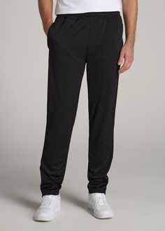 About Our Tall Men's Pants These men's tall athletic pants are a classic take on an athleisure essential. When it comes to athleisure, a good fit is key. You need something that's comfortable enough to relax in yet capable enough to work out in – but as a tall guy, it can be hard to find options that work for your height. You either have to compromise on a baggy fit or settle for lengths that are way too short. Not anymore. We know how hard it is to find quality styles when you're tall, which is Black Tapered Leg Activewear For Jogging, Black Tapered Leg Athleisure Activewear, Sportswear Sweatpants With Straight Hem, Casual Sports Bottoms With Straight Hem, Black Tapered Leg Sweatpants In Athleisure Style, Straight Hem Sportswear Sweatpants, Black Tapered Leg Athleisure Sweatpants, Black Tapered Leg Activewear For Sports, Sporty Sweatpants With Straight Hem For Sports