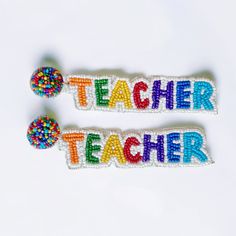 Hey there fellow teachers or lovers of teachers! These one of a kind earrings are bound to get the kid's attention in class! Each piece is handmade by our artisans bring you a wearable work of art you will treasure for seasons to come. Free shipping and a free gift are included. Large: 5" X 1" Small: 3" X 3/4" Ships next business day. Handmade with love. Sale items are not returnable. Fun Handmade Adjustable Earrings, Handmade Adjustable Fun Earrings, Handmade Adjustable Fun Beaded Earrings, Handmade Fun Jewelry For Mother's Day, Fun Handmade Jewelry For Mother's Day, Playful Multicolor Personalized Earrings, Playful Personalized Multicolor Earrings, Handmade Fun Beaded Earrings For Gifts, Fun Beaded Earrings For Gifts