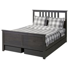 a bed with two drawers underneath it and a checkered comforter on the bottom