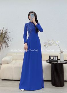 🌻Material: chiffon. 🌻Stretchy level: 3/10 🌻 The measurement of this ao dai (long dress) is in Vietnamese size (American size tends to be bigger for the same size). Please LOOK AT THE SIZE CHART CAREFULLY BEFORE ORDERING. There might have some chalk writings on the fabric due to making process. These marks can be washed away easily. 🌻🌻No returns or exchanges Buyer can contact seller about any issues with an order. 🌸 Follow us Facebook/aodaiemily www.aodaiemily.com 💜 Thank you very much!💜 Elegant Blue Gown For Ceremony, Traditional Long Sleeve Ao Dai For Banquet, Elegant Georgette Gown For Banquet, Fitted Blue Cheongsam For Wedding, Festive Long Sleeve Ao Dai For Ceremony, Elegant Ao Dai For Wedding, Elegant Long Sleeve Ao Dai For Wedding, Long Cheongsam For Wedding And Festive Occasions, Festive Long Cheongsam For Wedding