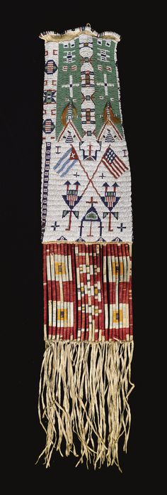 an embroidered piece with fringes and flags on it