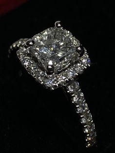 an engagement ring with diamonds on it