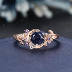 Nature Inspired Round Galaxy Blue Sandstone Amethyst Wedding Ring Unique Moon Leaf Vine Blue Goldstone Engagement Ring Art Deco Promise Ring Engagement Ring: 5mm round cut blue sandstone The side stones are 1.5mm round amethyst and moissanite Material Metal: 925 sterling silver, Solid 10k/14k/18k gold,platinum This jewelry is made to order, it can be made with any gemstone/metals. 2-3 weeks to finish. Default Shipping method is usps. 30 days non-hassle return policy.For returned items,there may Gemstone Wedding Rings Brilliant Earth, Luxury Celestial Moonstone Ring With Accent Stones, Luxury Gemstone Stackable Rings For Promise, Luxury Rings With Natural Stones For Promise, Luxury Celestial Diamond Promise Ring, Nature Inspired Wedding Ring Alexandrite, Luxury Celestial Moonstone Ring For Anniversary, Engagement Ring Diamond And Moon Stone, Luxury Celestial Moonstone Ring For Wedding