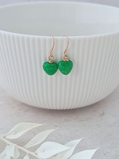 Cute emerald green jade hearts on gold plated French earring wires. The jade hearts measure approximately 8mm. Simple and easy to wear.  Perfect little gift. Can also be made in silver, please message me if you require silver. The earrings will arrive on a card and placed inside an organza bag ready for giving. Delicate Green Jewelry With Birth Flower, Delicate Green Birth Flower Jewelry, 35th Wedding Anniversary Gift, Jade Jewellery, 35th Wedding Anniversary, Heart Jewellery, Earring Wires, Jade Earrings, Botanical Jewelry