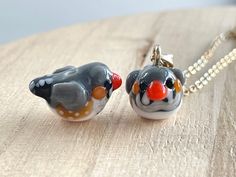 This Australian Zebra Finch glass beads necklace is cute and dainty, which is a perfect gift for kids and friends.  It is made of the following: 🔹 Handmade glass beads: H10 x W12 x D18mm, each bead is unique so there is a slightly different from bead to bead 🔹 Necklace chain: gold or silver plated over brass 🔹 Necklace Length: choose the exact length of the chain (the length includes clasp and findings).   【PLEASE NOTE THE FOLLOWINGS BEFORE PURCHASE】 ✔ VAT, GST and any other taxes from your country are NOT included in the listing price. Buyers are responsible for any aforesaid taxes and must be paid upon delivery. ✔ Buyers are responsible for any customs and import taxes that may apply. I'm not responsible for delays due to customs. ✔ Colors may vary on different computer monitors and i Whimsical Czech Glass Necklaces As Gifts, Whimsical Czech Glass Necklaces For Gifts, Whimsical Czech Glass Necklace For Gift, Whimsical Round Beads Necklace As A Gift, Playful Jewelry With Tiny Beads For Gifts, Glass Necklaces With Tiny Beads For Gifts, Glass Necklace With Tiny Beads For Gift, Whimsical Glass Necklaces As Gifts, Czech Glass Tiny Beads Necklace For Gift